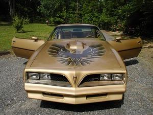 Gold Bird with wings spread.