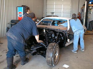 The lads pushing her abck to the hoist